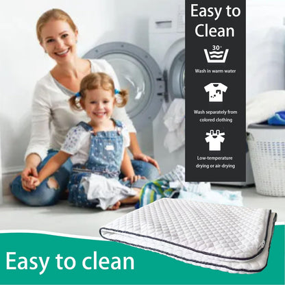 A quilted white mattress topper with a dark gray border is shown in the foreground, with a woman and child sitting in front of a washing machine in the background. Text overlays read 'Easy to Clean' with icons indicating wash and dry care instructions.