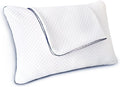 A white contoured pillow with a diamond-quilted texture and dark blue piping along the edges, shown on a plain white background.